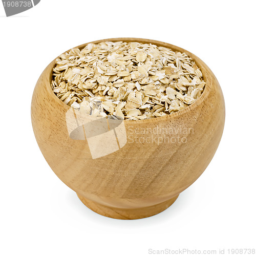 Image of Oat flakes in a wooden bowl