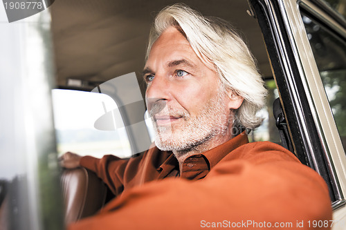 Image of man in his car