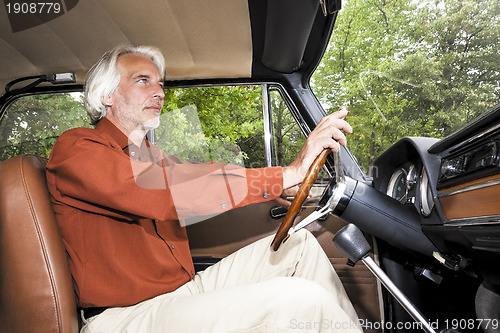 Image of man in his car