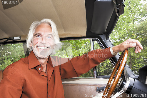 Image of man in his car