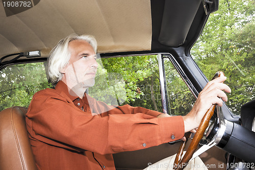Image of man in his car