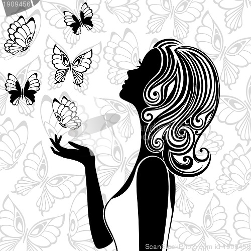 Image of Silhouette of young woman with flying butterflies