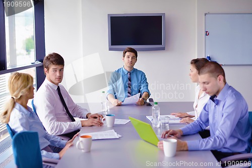 Image of business people in a meeting at office