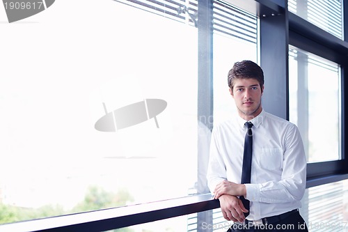Image of happy young business man at office