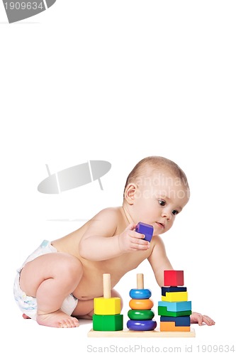 Image of Small child play with toys on white background