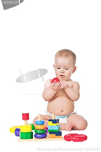 Image of Small child play with toys on white background