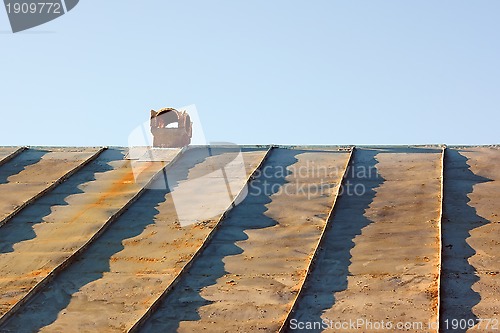 Image of Chimney on an obsolete tinny roof