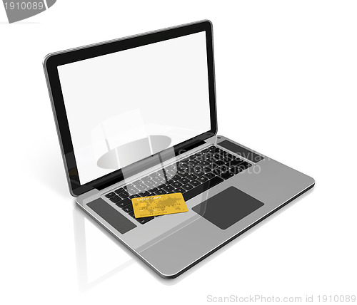 Image of gold credit card on laptop