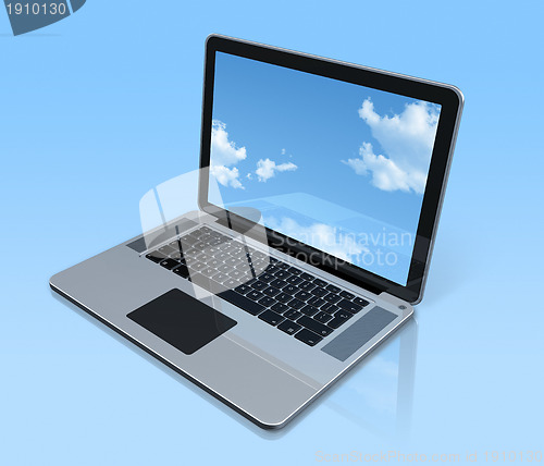 Image of Laptop computer isolated on blue with sky screen