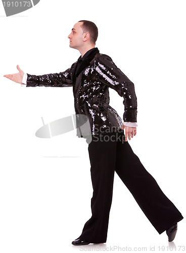 Image of side view of a flashy male latino dancer