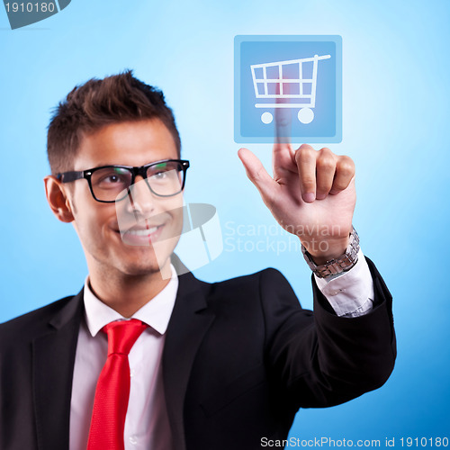 Image of Business man pressing a shopping button