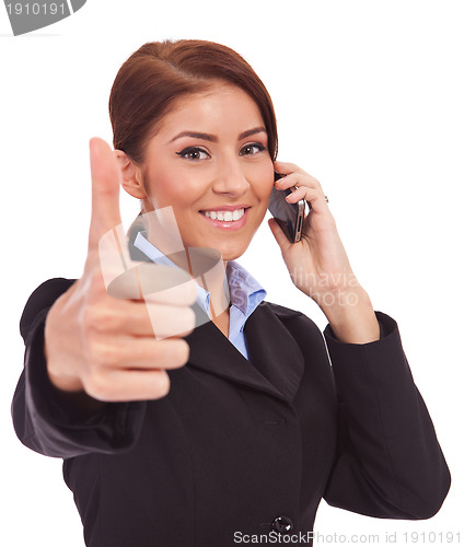 Image of  woman with phone and thumbs up gesture