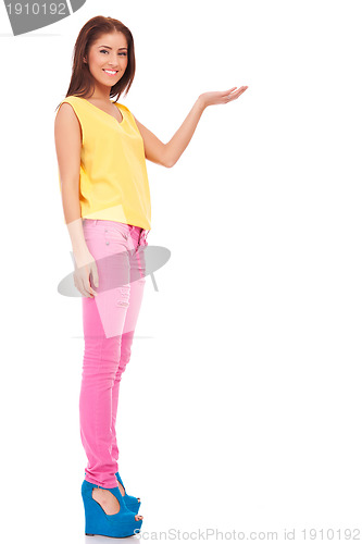 Image of young casual woman presenting something