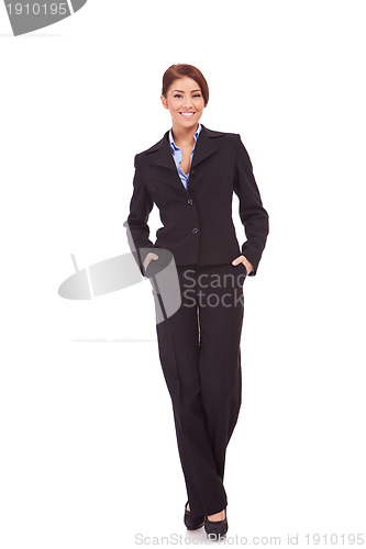 Image of businesswoman with hands in pockets