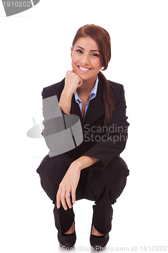 Image of  happy young business woman standing down