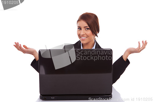 Image of business woman is welcoming you to her desk