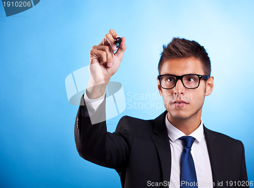 Image of Businessman writing or drawing with marker 