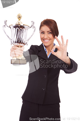 Image of business woman with trophy make ok gesture