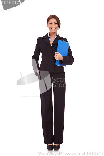 Image of business woman standing with her clipboard