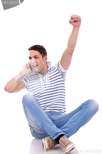 Image of casual man winning on the phone