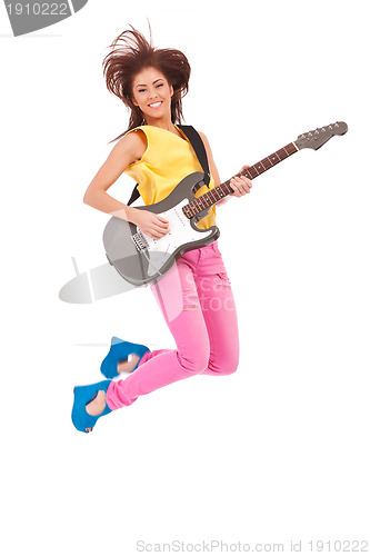 Image of passionate woman guitarist jumps in the air