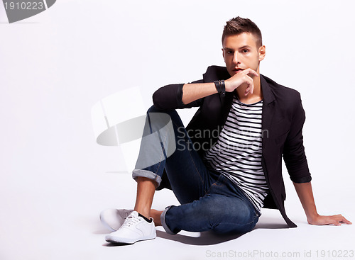 Image of cool fashion male model sitting