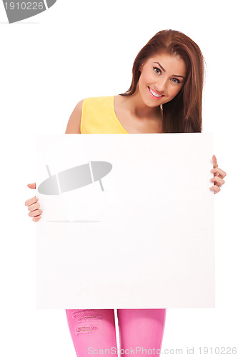 Image of Attractive casual woman with blank poster 