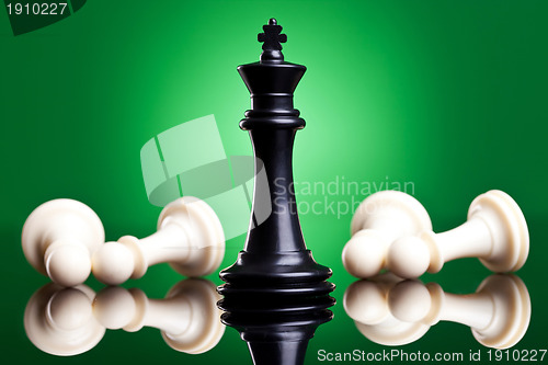 Image of black king defeates white pawns