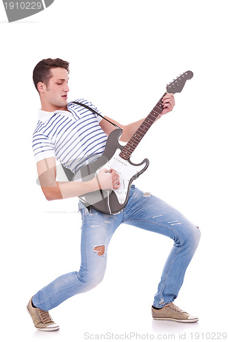 Image of young man playing guitar