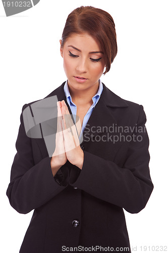 Image of business woman praying