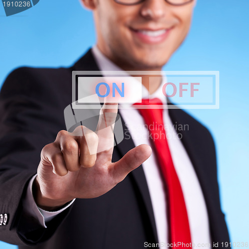 Image of business man pushing On button