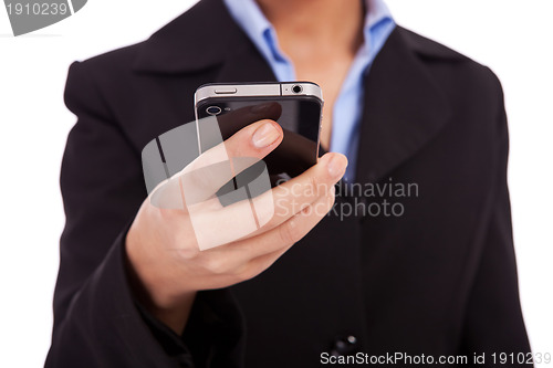 Image of business woman texting on a smartphone