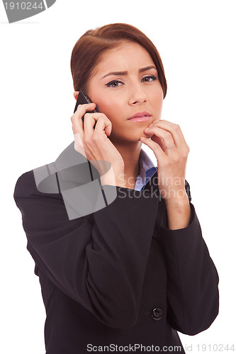 Image of business woman worries onthe phone