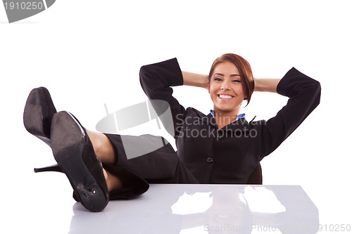 Image of successful business woman resting