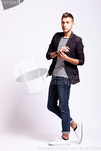 Image of young fashion man in a pose