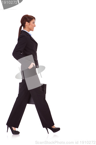 Image of business woman walking with a briefcase