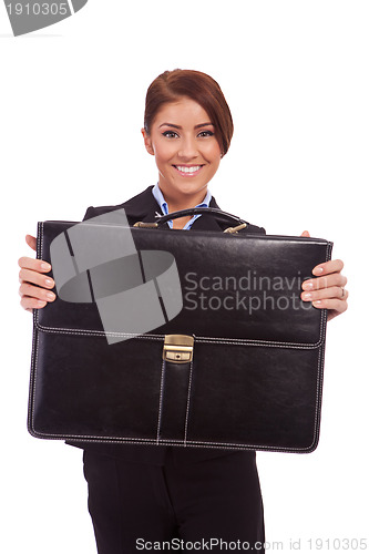 Image of  business woman handing a suit case to you