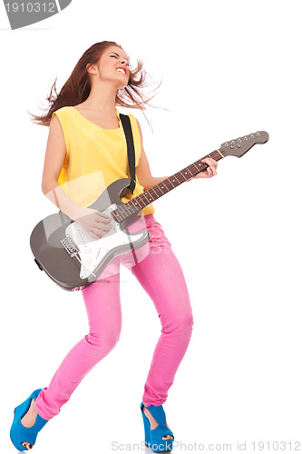 Image of Young woman playing the guitar 