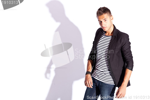 Image of portrait of a young fashion man posing