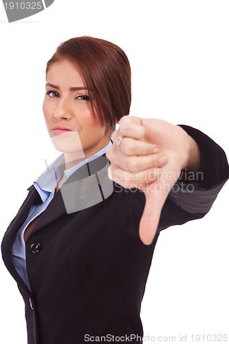 Image of business woman gesturing thumbs down 