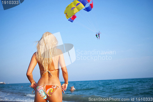 Image of woman looking forward to a paragliding adventure
