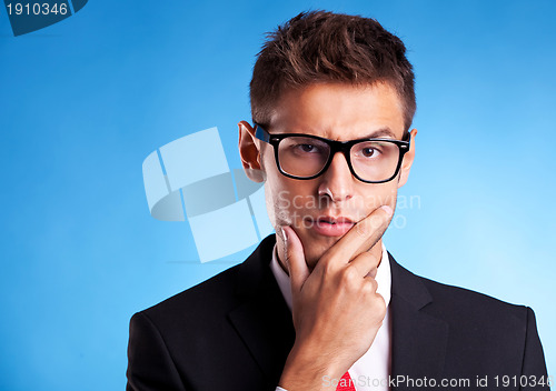 Image of pensive young business man