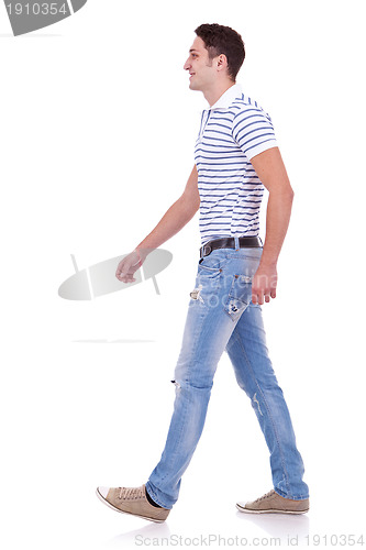 Image of side view of a fashion man walking forward 