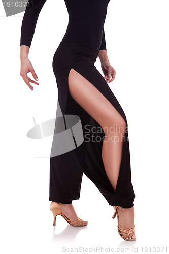 Image of legs of a young woman salsa dancer