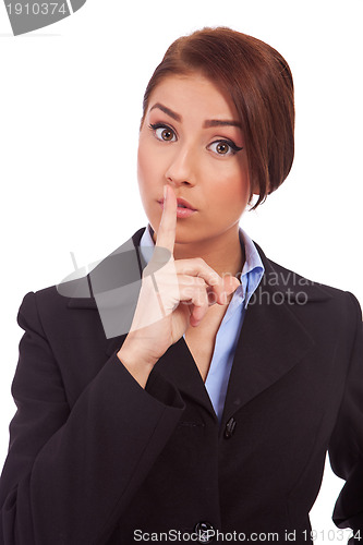 Image of business woman making quiet gesture