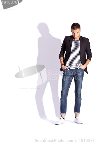 Image of young fashion man looking down