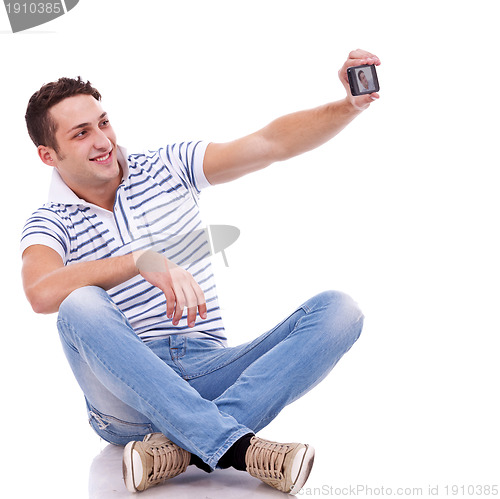 Image of man taking a picture of him self with phone