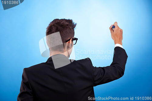 Image of business man writing with marker