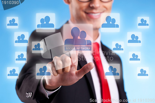 Image of business mna  pressing a social network button