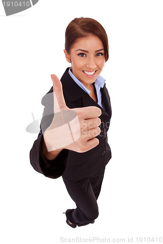 Image of business woman isolated giving thumbs up sign